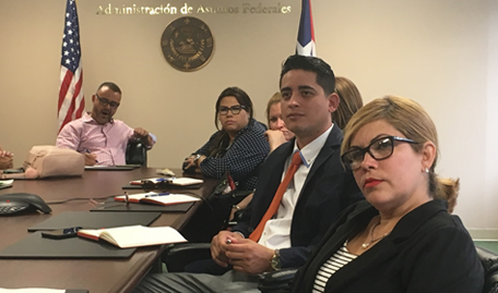 Several of the Pilar Barbosa fellows listen attentively to George Laws of the Puerto Rico Federal Affairs Administration describe issues in Puerto Rican and American politics. Attendees at Pilar Barbosa listen intently