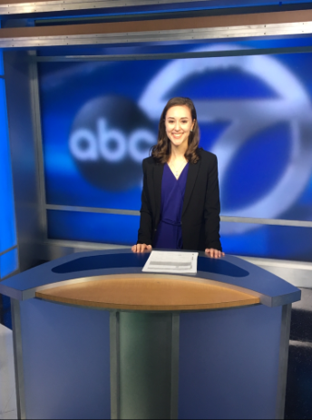 Emily at the news anchor's desk ABC 7